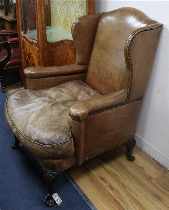 A leather wing armchair